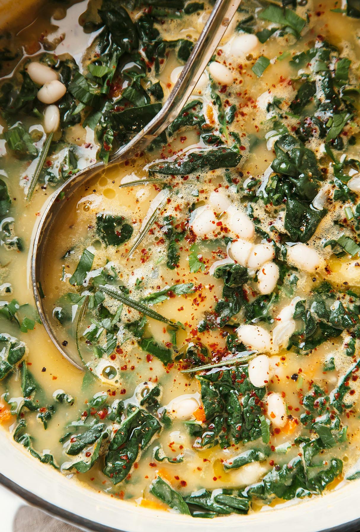 Weeknight-friendly Creamy White Bean Soup with Kale, Rosemary, and Lemon